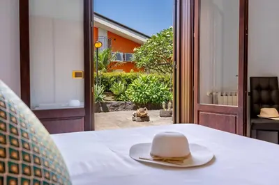 Letto o letti in una camera di Villa Cesare