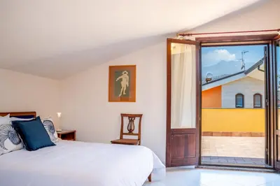 Letto o letti in una camera di Villa Cesare