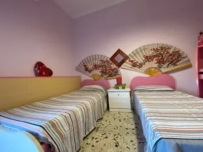 Letto o letti in una camera di a casa di Martina