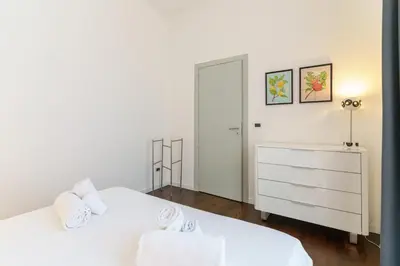 Letto o letti in una camera di Terrazza Cirnauti il pieno di luce in centro città