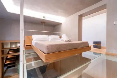 Letto o letti in una camera di Luxury urban craft