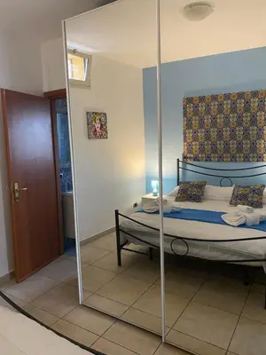 Letto o letti in una camera di Vacanza a Catania House