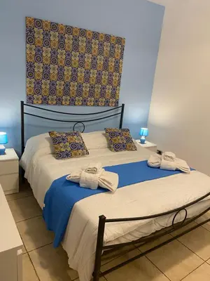 Letto o letti in una camera di Vacanza a Catania House