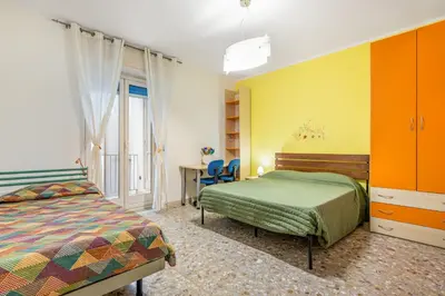 Letto o letti in una camera di GuestHost - Charming Apartment Near Villa Bellini in Catania