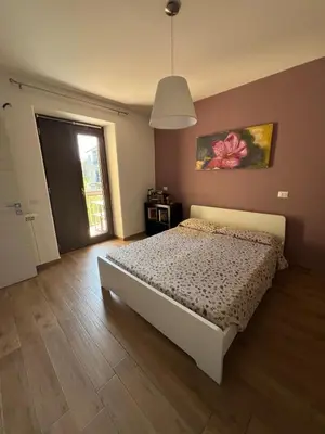 Letto o letti in una camera di B&B La Rosa dell'Etna - Appartamento completo