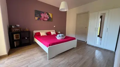 Letto o letti in una camera di B&B La Rosa dell'Etna - Appartamento completo