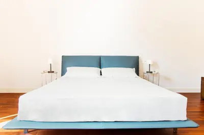 Letto o letti in una camera di Palazzo Marinella Sicilian Luxury Stay