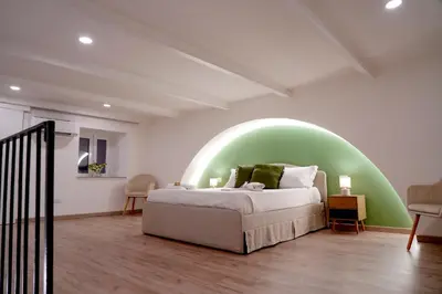Letto o letti in una camera di R-HOME Crispi