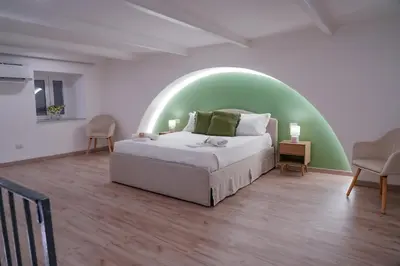 Letto o letti in una camera di R-HOME Crispi
