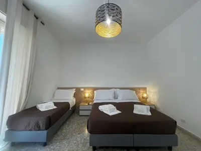 Letto o letti in una camera di Corso Italia 72
