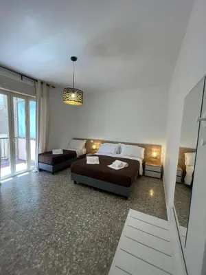 Letto o letti in una camera di Corso Italia 72
