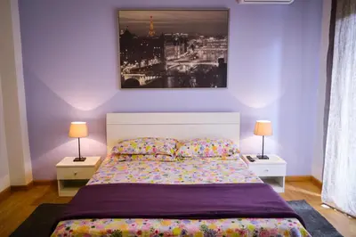 Letto o letti in una camera di Policlinico Apartments