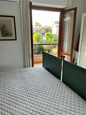 Letto o letti in una camera di Appartamento Mediterraneo