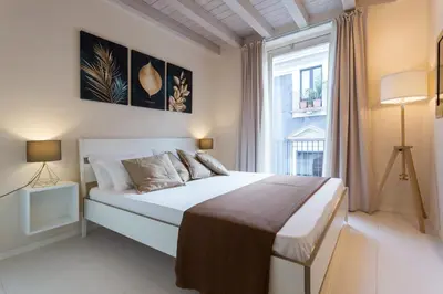 Letto o letti in una camera di Stesicoro Exclusive House