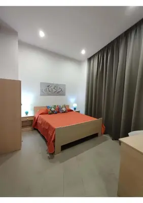 Letto o letti in una camera di Sicilian House