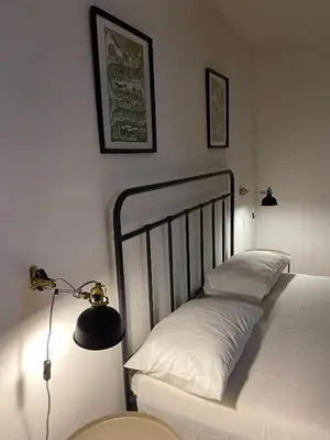 Letto o letti in una camera di Cortile Benedettini