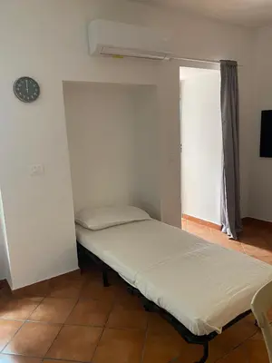 Letto o letti in una camera di Cortile Benedettini