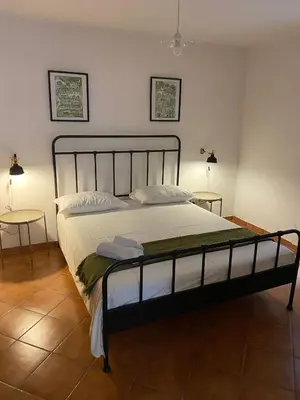 Letto o letti in una camera di Cortile Benedettini