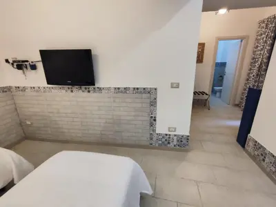 Letto o letti in una camera di Vico Si cu ro