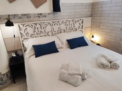 Letto o letti in una camera di Vico Si cu ro