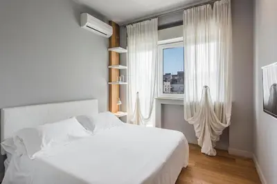 Letto o letti in una camera di Ferrini Home - Suites