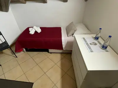 Letto o letti in una camera di casa catania termini home 4