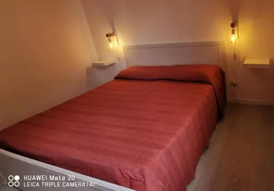 Letto o letti in una camera di Villa Eufemia