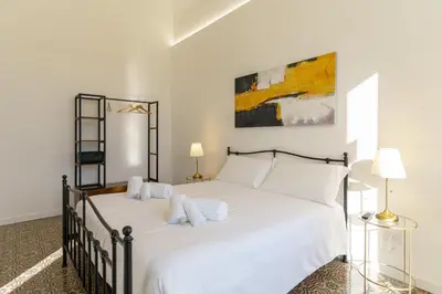 Letto o letti in una camera di KleoSuites