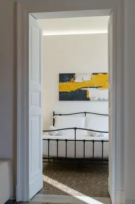 Letto o letti in una camera di KleoSuites