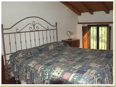 Letto o letti in una camera di Codavolpe giardino di tea