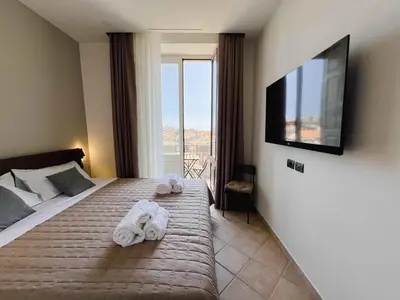 Letto o letti in una camera di B&B Don Diego Pedara