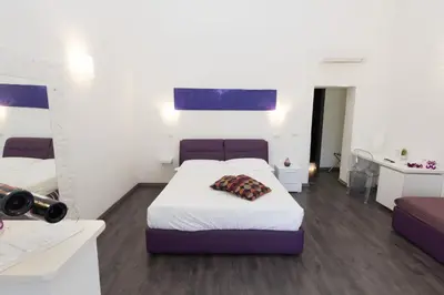 Letto o letti in una camera di Etna Suite Group
