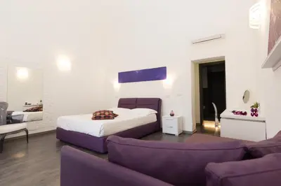 Letto o letti in una camera di Etna Suite Group