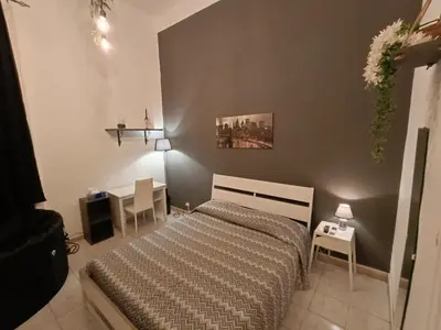 Letto o letti in una camera di Domus Etna