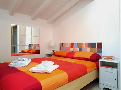 Letto o letti in una camera di Casa Linda