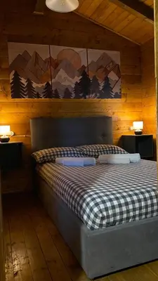 Letto o letti in una camera di Woods Etna Chalet