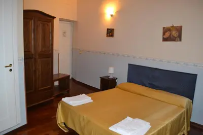 Letto o letti in una camera di Stesicorea Palace