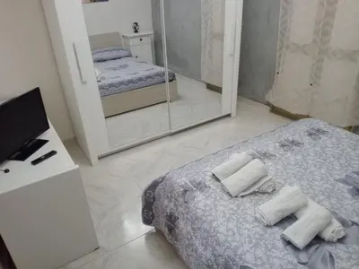 Letto o letti in una camera di Casa vacanza LA MARTINA & D'ALESSANDRO