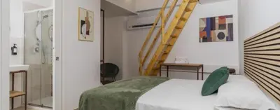 Letto o letti in una camera di sikelia rooms