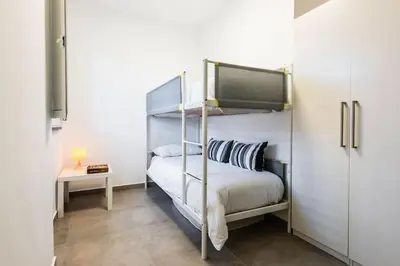 Letto o letti in una camera di Oasi Agrumi e Mare