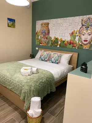 Letto o letti in una camera di Terra d'Agrumi Rooms