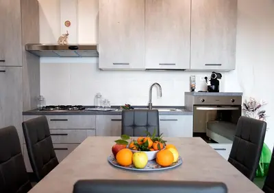 Cucina o angolo cottura di La Rosa dell'Etna - Apartments