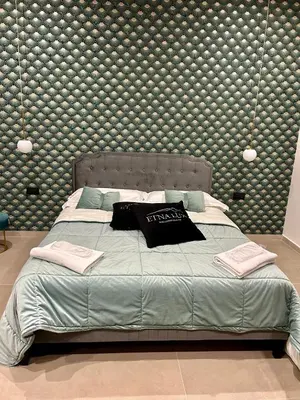 Letto o letti in una camera di EtnaLux