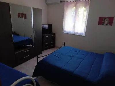 Letto o letti in una camera di Casa Noemi