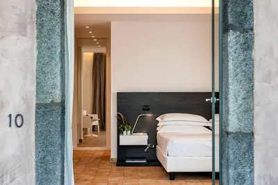 Letto o letti in una camera di Ramo d'Aria Etna Boutique Hotel