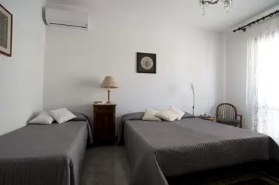 Letto o letti in una camera di Relais Chiesa Madre - Rooms and Apartments