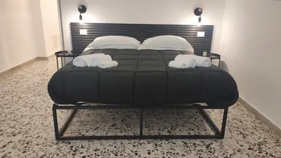 Letto o letti in una camera di Majorana's LabSuites