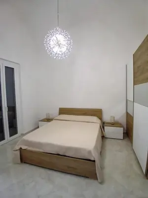 Letto o letti in una camera di casa Mariel