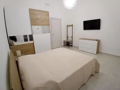 Letto o letti in una camera di casa Mariel