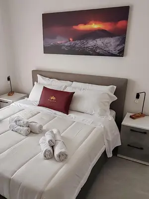 Letto o letti in una camera di Infinity House Catania